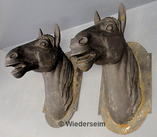 Pair of large cast iron horse heads