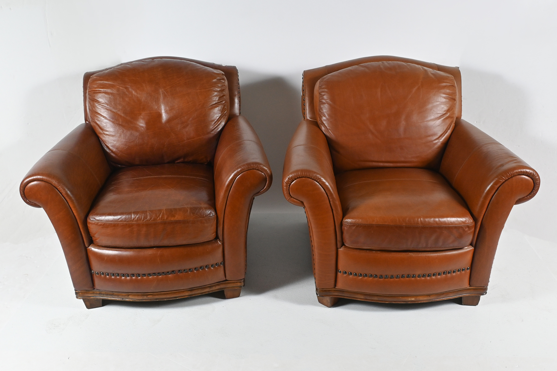 PAIR OF LEATHER CLUB CHAIRS: A pair