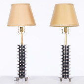 PAIR OF METAL LAMPS IN THE MAN