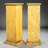 PAIR OF OCHRE FAUX MARBRE PEDE