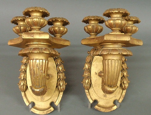 Pair of ornately carved sconces