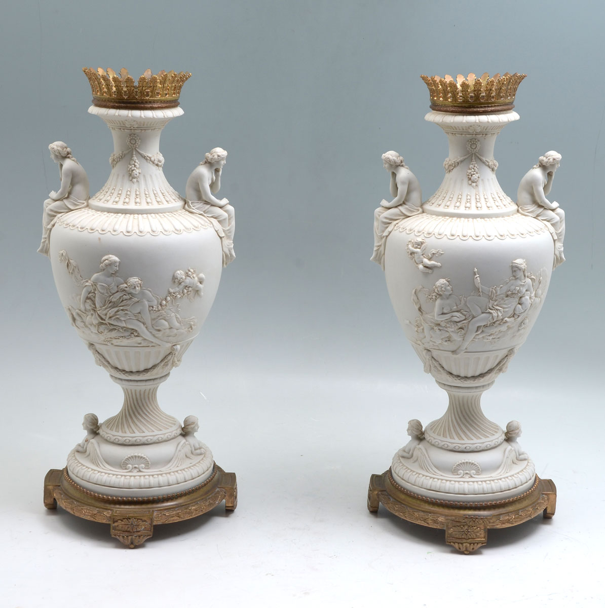 PAIR OF PARIAN URNS: Having