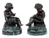 PAIR OF PATINATED BRONZE CHERU
