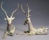 PAIR OF PATINATED METAL RECUMB