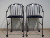 PAIR OF PATINATED METAL UPHOLS
