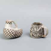 PAIR OF PREHISTORIC CERAMIC IT