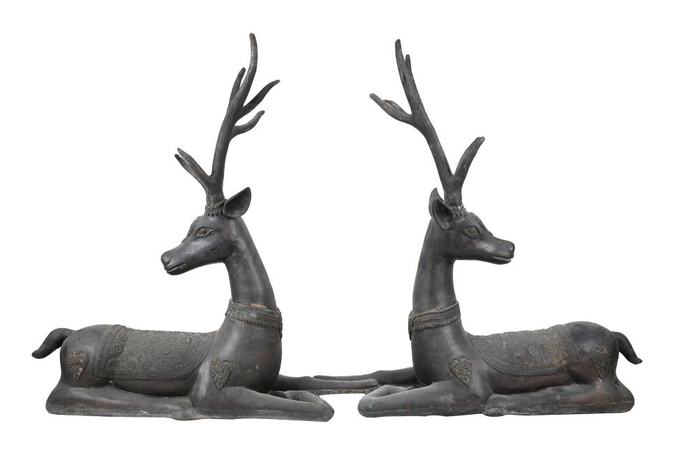 PAIR OF RECLINING BRONZE DEER