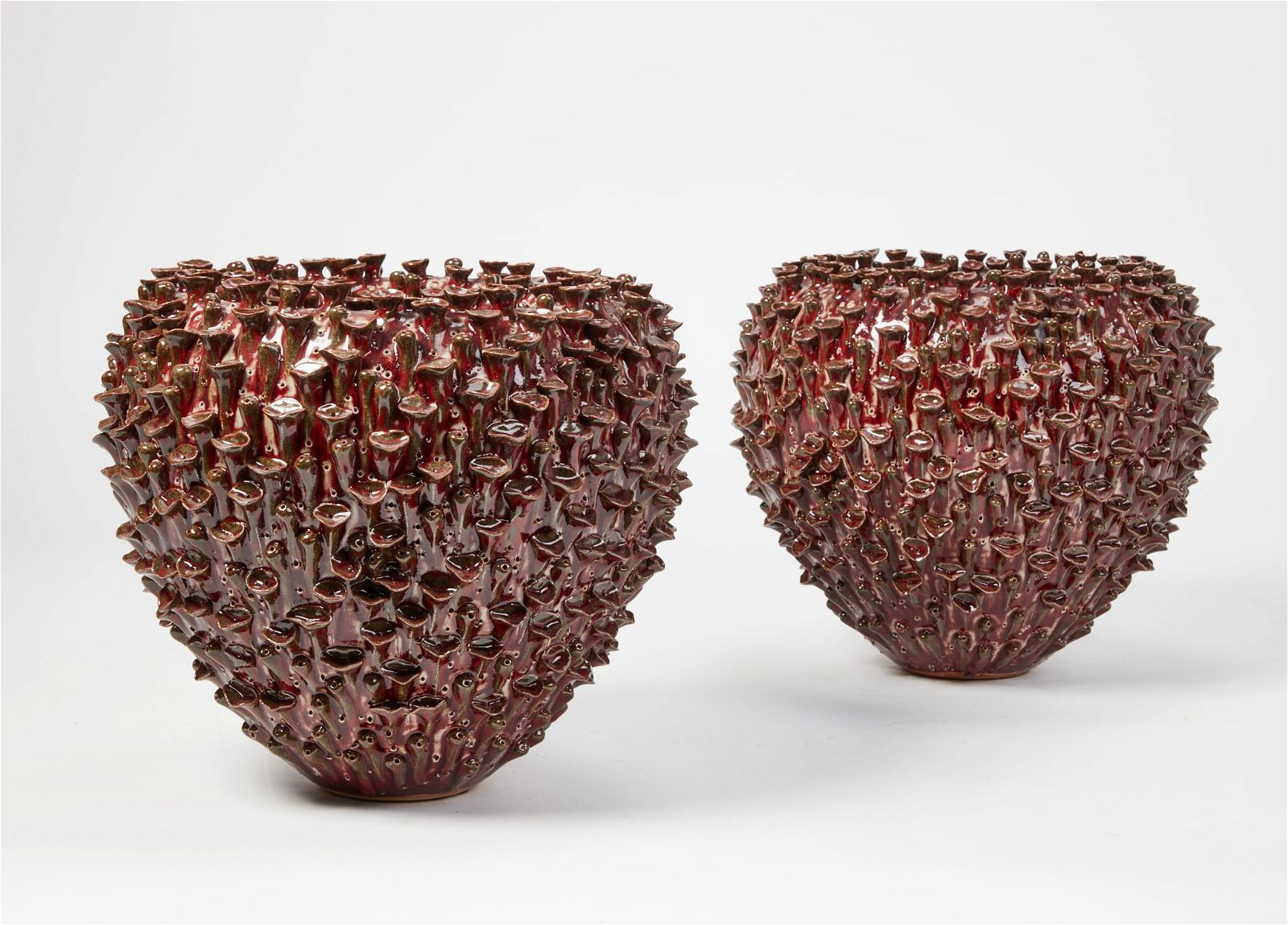 PAIR OF RED GLAZED STUDIO POTTERY
