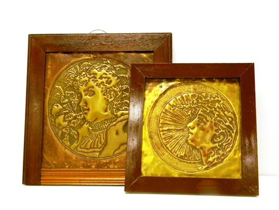 Pair of repousse brass wall