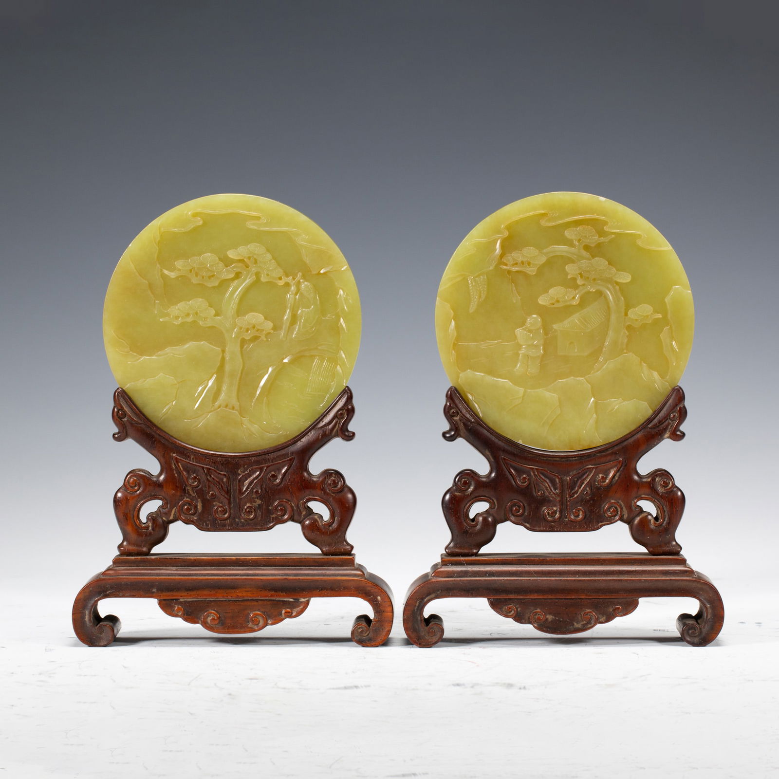 PAIR OF ROUND JADE CARVINGS WITH