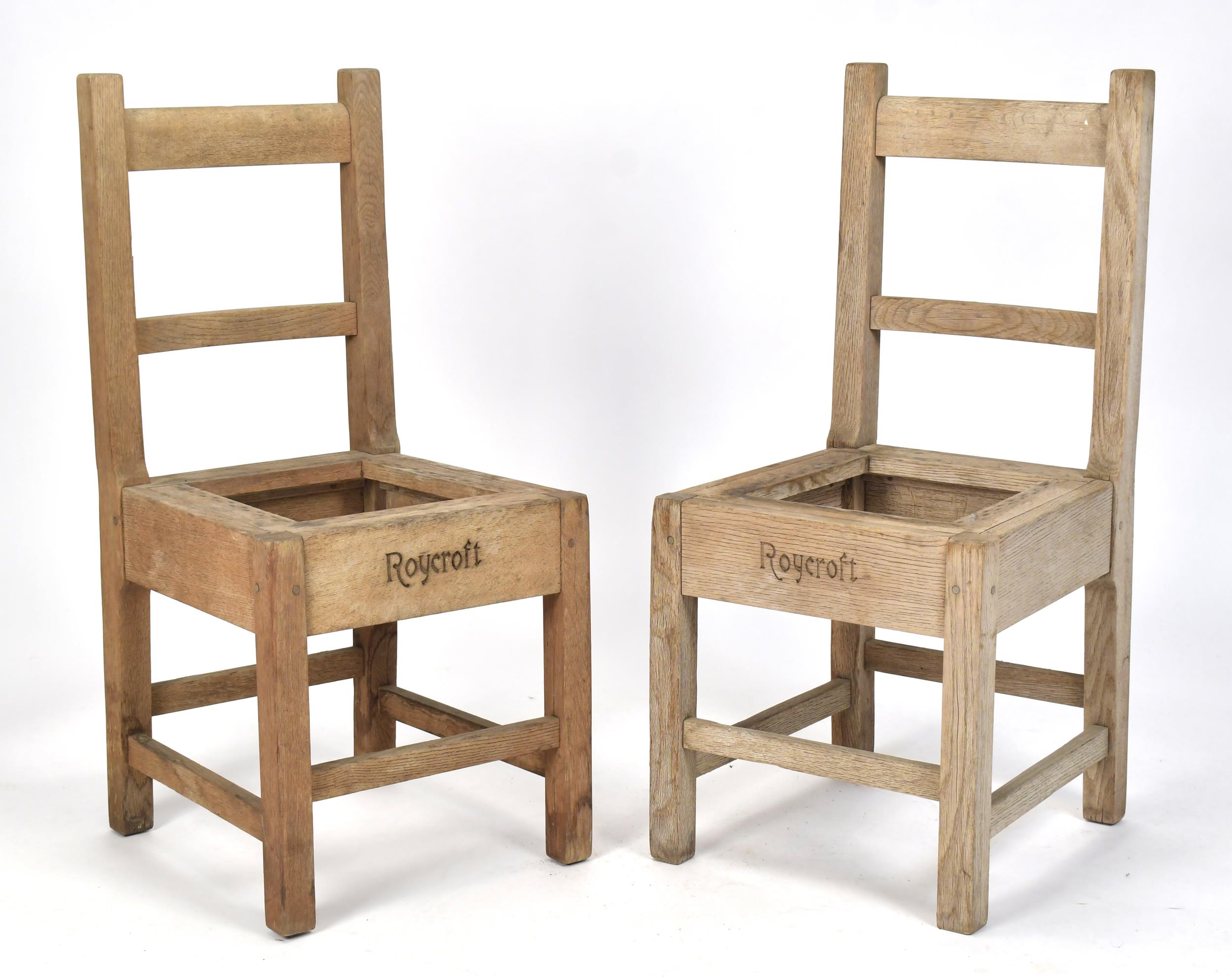 PAIR OF ROYCROFT SIGNED OAK CHAIRS.