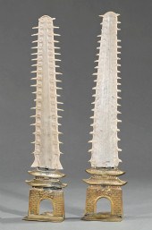 PAIR OF SAWFISH AND BRASS BOOK