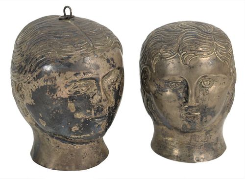 PAIR OF SILVER HEADS IN THE FORM OF