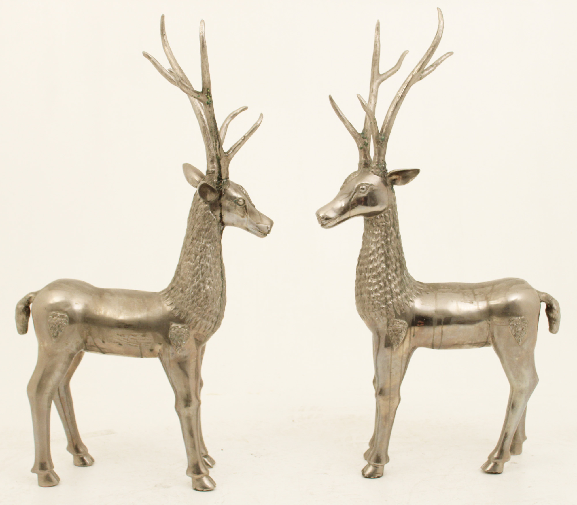 PAIR OF SILVERED METAL SCULPTURES