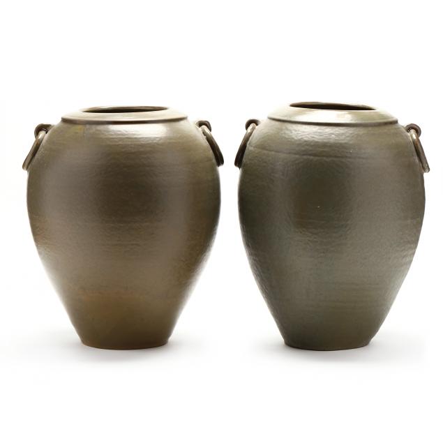 PAIR OF SMALL FLOOR URNS,