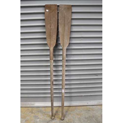 Pair of small row boat oars, each