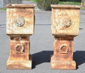 PAIR OF SQUARE IRON URNS ON PE