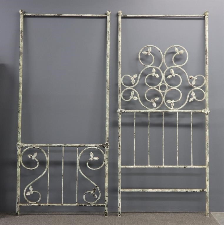 Pair of tall iron single beds circa