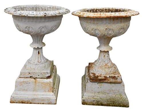 PAIR OF VICTORIAN IRON URNS ON