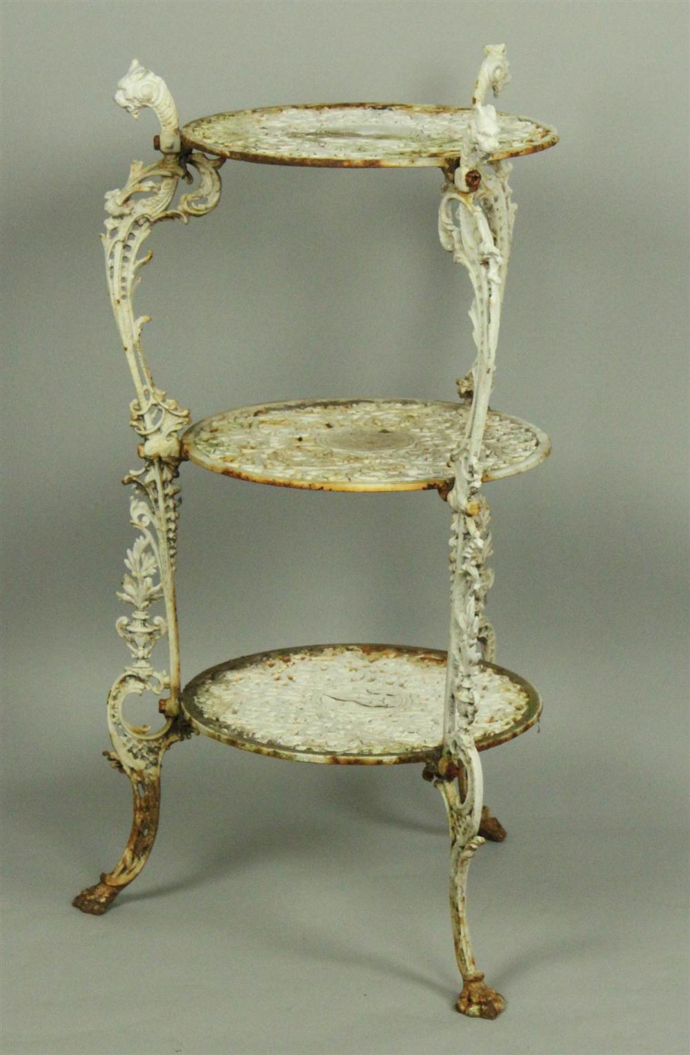 PAIR OF WHITE CAST-IRON URNS ON