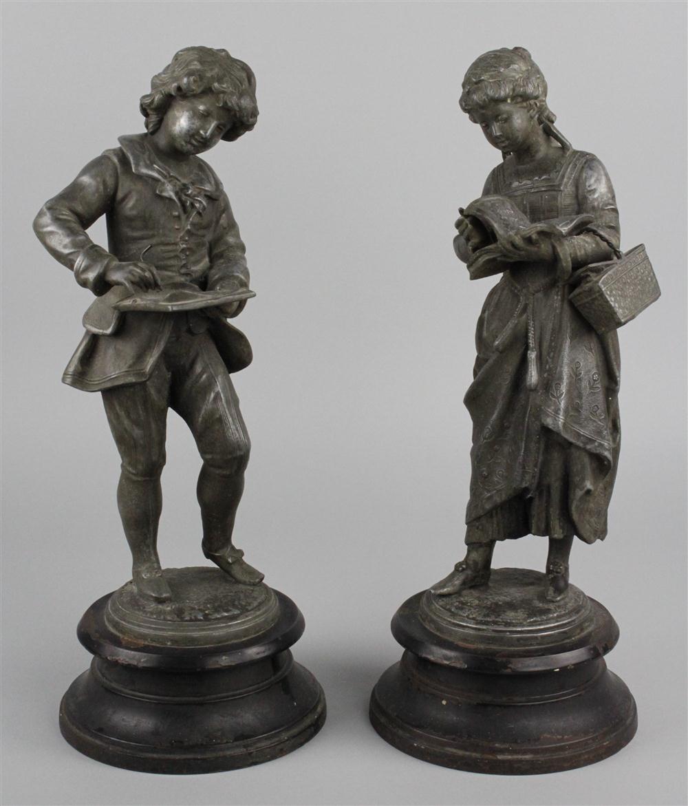 PAIR OF WHITE METAL FIGURES OF