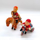 PAIR OF WIND UP SANTA CLAUS TO