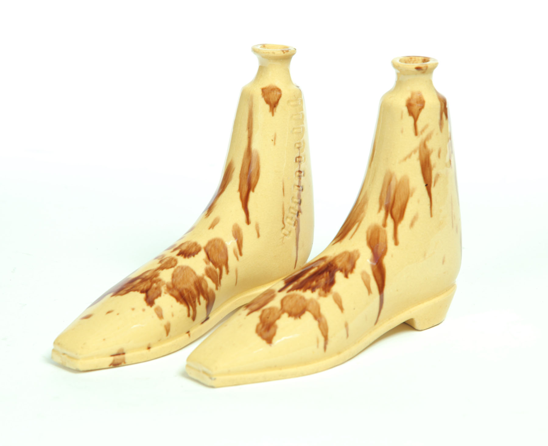 PAIR OF YELLOWWARE SHOE FLASKS. 