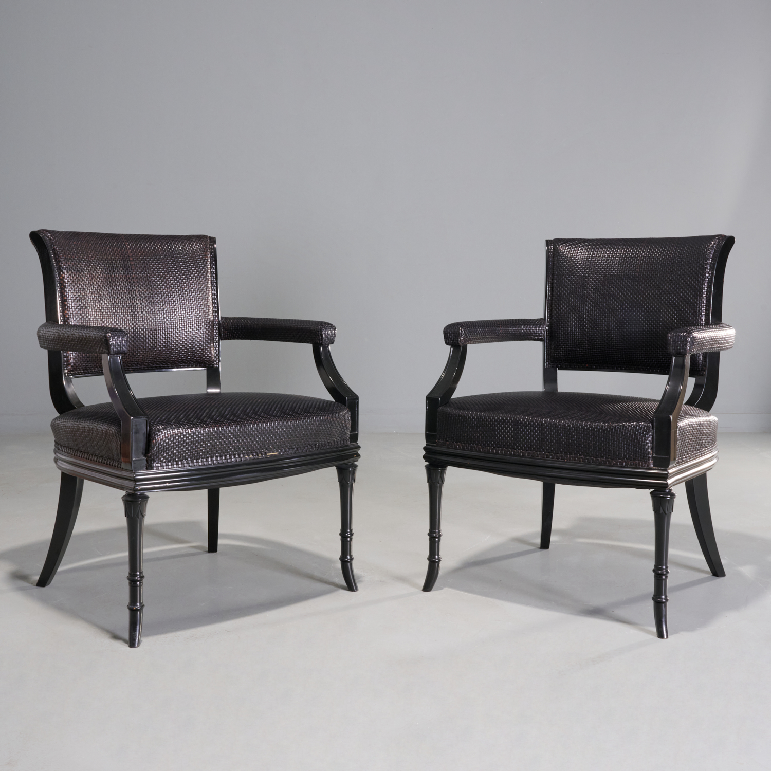 PAIR WOVEN LEATHER ARMCHAIRS, PETER