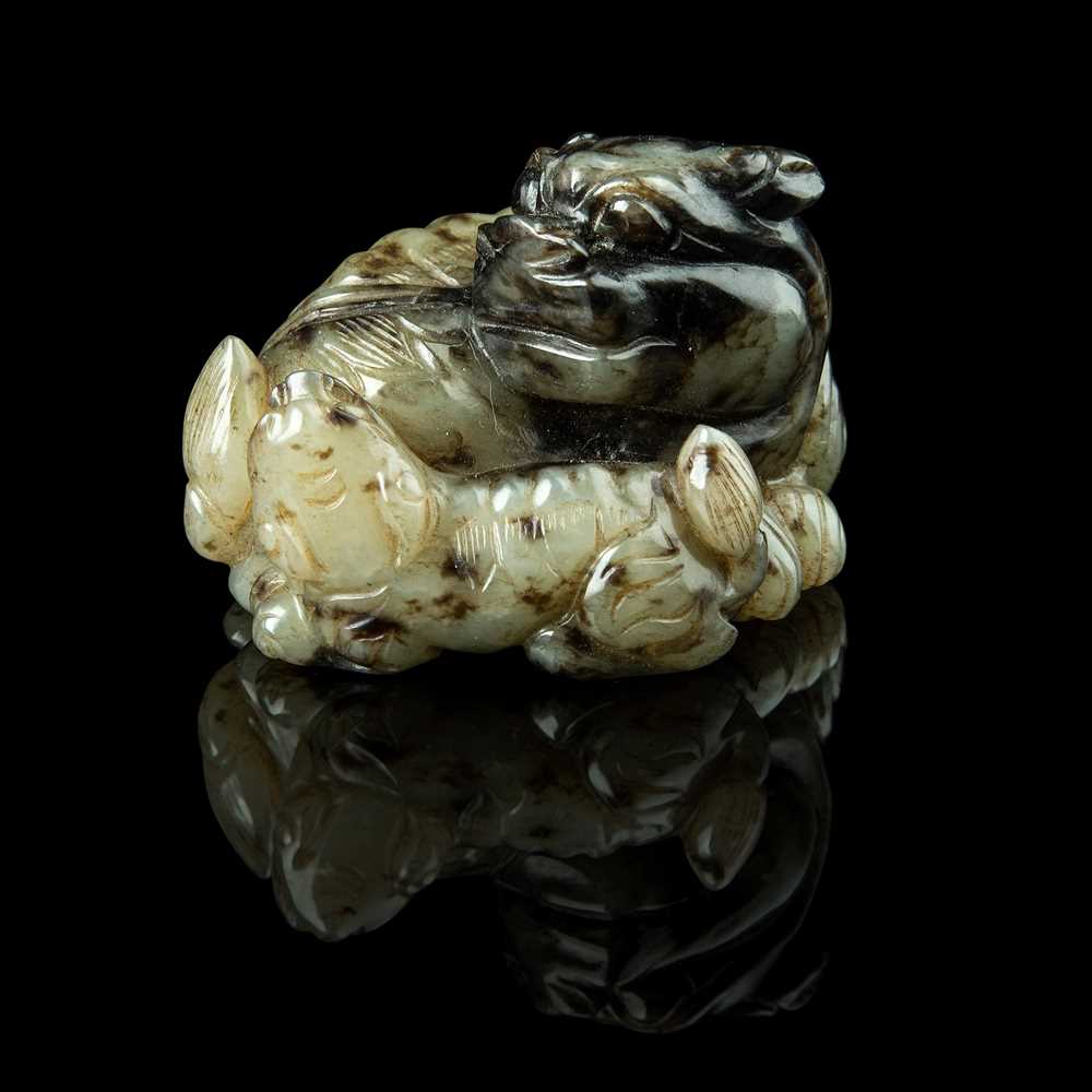 PALE CELADON JADE CARVING OF A