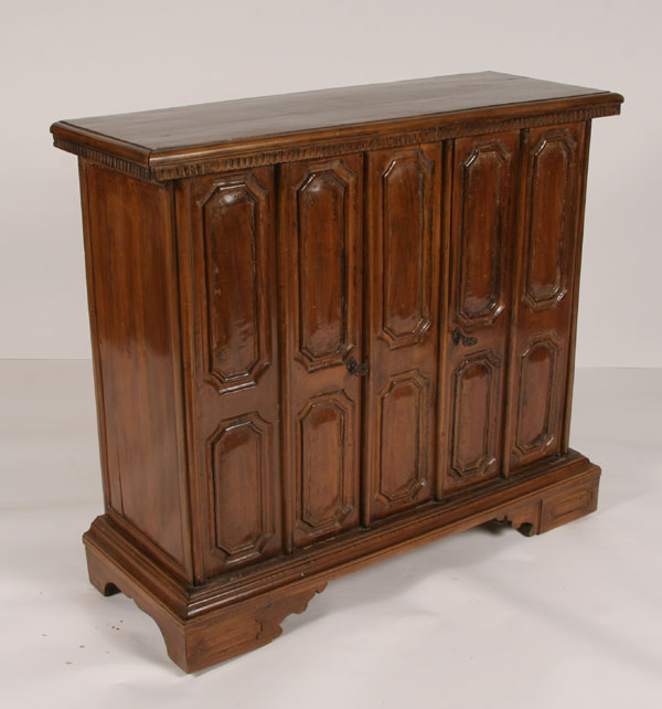 Paneled wood two door cabinet;