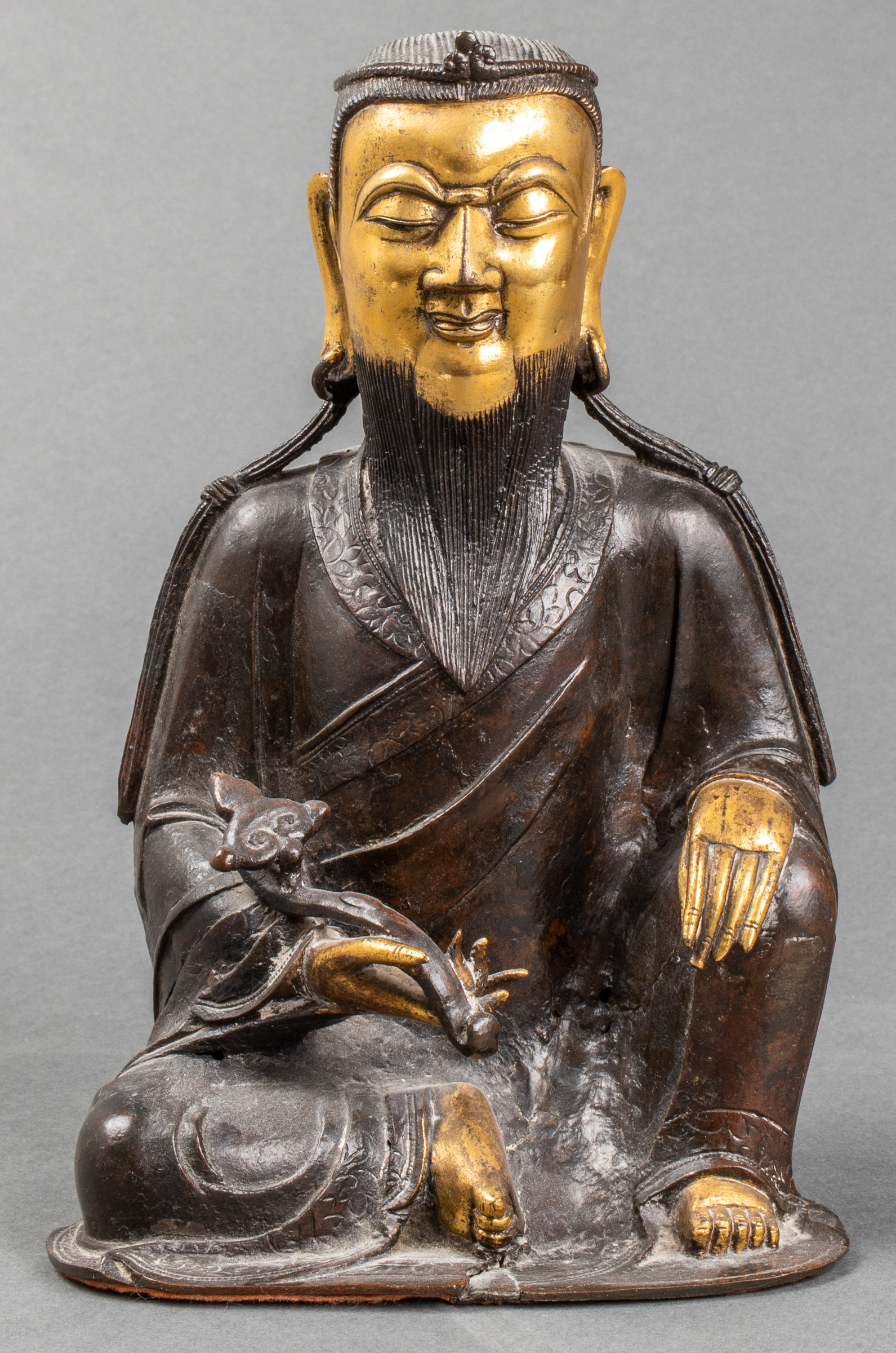 PARCEL GILT BRONZE FIGURE OF A
