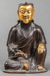 PARCEL GILT BRONZE FIGURE OF A