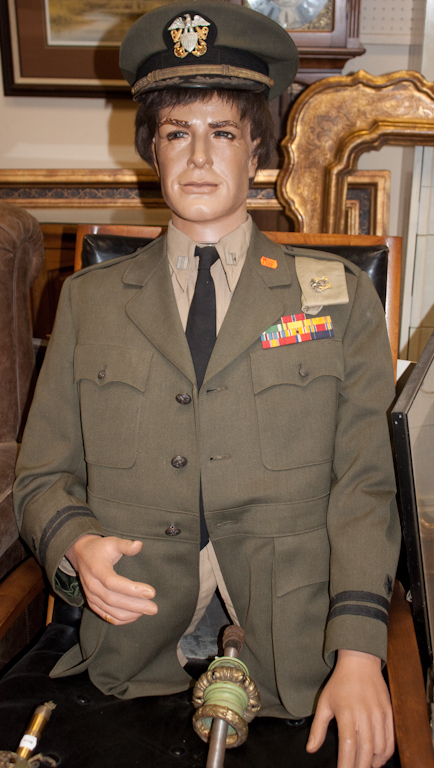 Partial military uniform and hat