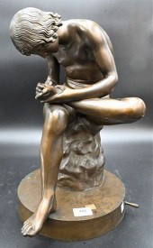 PATINATED BRONZE FIGURE OF SPI