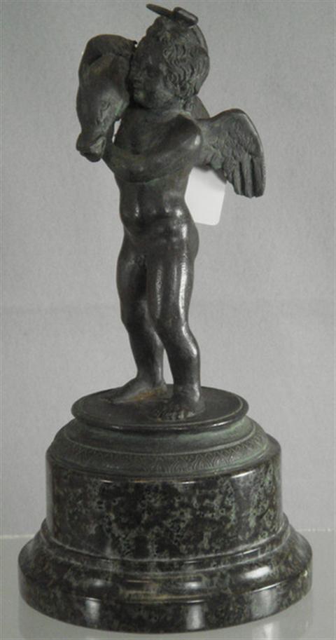 Patinated bronze figurine of a