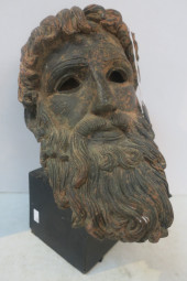 PATINATED BRONZE HEAD OF POSEI