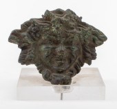 PATINATED BRONZE MASQUE OF BAC