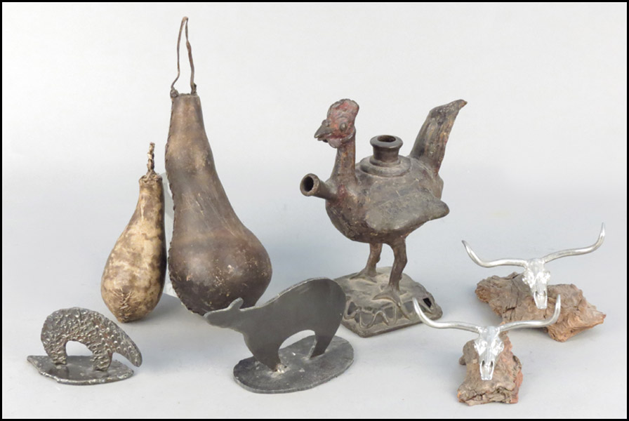 PATINATED METAL BIRD FORM VESSEL.