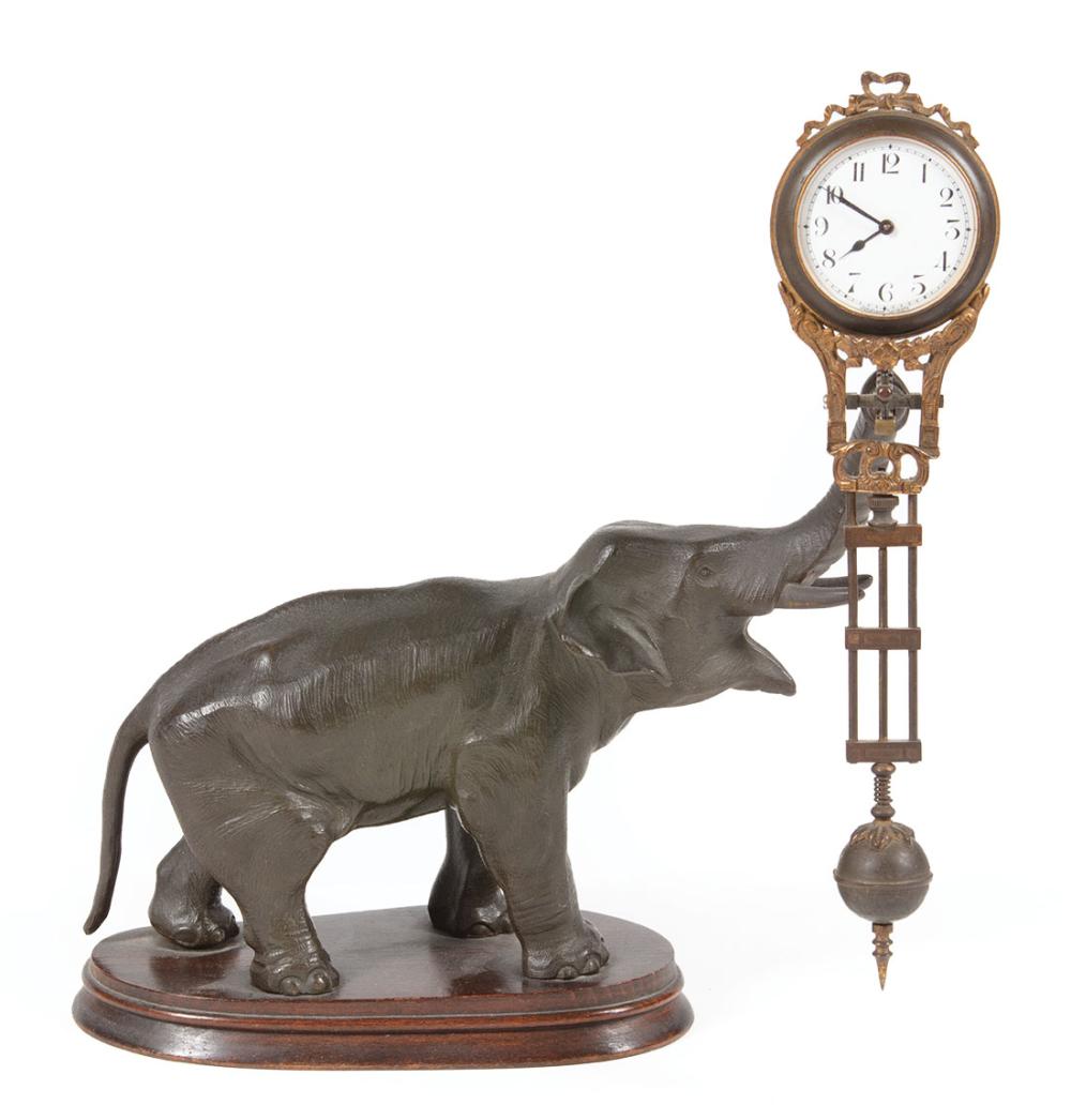PATINATED METAL FIGURAL SWINGING
