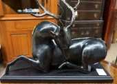 PATINATED METAL FIGURE OF A RE