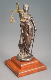 PATINATED METAL FIGURE OF BLIN