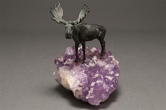 Patinated metal moose figure on
