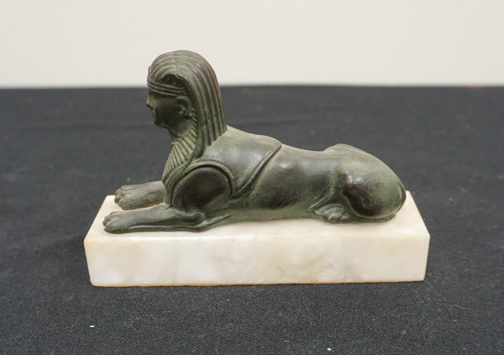 PATINATED METAL SPHINX ON FAUX