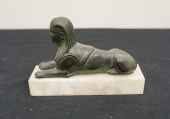 PATINATED METAL SPHINX ON FAUX