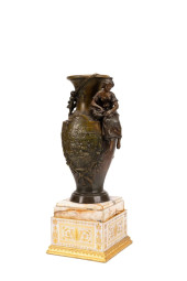 PATINATED URN ON MARBLE BASE,