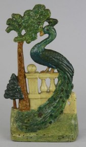 PEACOCK ON FENCE DOORSTOP ''co