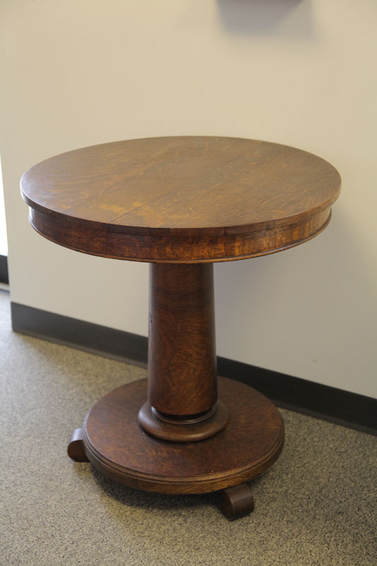 PEDASTAL STAND. Oak having a