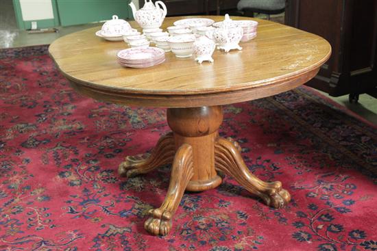 PEDESTAL TABLE. Oak having a