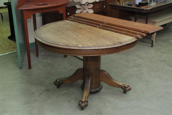 PEDESTAL TABLE. Oak with a round