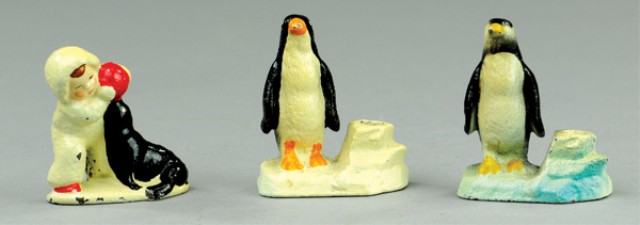 PENGUINS AND CHILD WITH SEAL